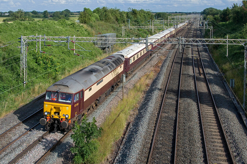 57313, 17.36 Wolverton Centre Sidings-Milton Keynes Central (via Northampton) (5Z29, 6L), Victoria bridge 
 In superb evening light at Victoria bridge just south of Roade 57313 'Scarborough Castle' leads the delayed 17.36 Wolverton Centre Sidings to Milton Keynes via a Northampton reversal empty stock working. The train had been laid over for most of the duration of the British Grad Prix at Silverstone and was now returning to pick racegoers up from Milton Keynes who had been taken there from the track by coach. Incidentally, after a pretty mundane race that was livened up by a safety car event, Max Verstappen won but with two British drivers on the podium in the form of Lando Norris and Lewis Hamilton. 
 Keywords: 57313 17.36 Wolverton Centre Sidings-Milton Keynes Central via Northampton 5Z29 Victoria bridge WCR Northern Belle Scarborough Castle