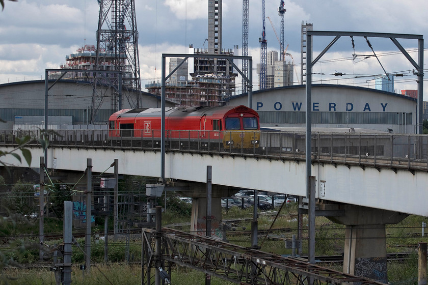 66135, 08.09 Dollands Moor-Scunthorpe Redbourn (4E26), Willesden viaduct 
 66135 crosses Willesden viaduct with the 08.09 Dollands Moor to Scunthorpe empty steel train. With the closure of the vast Scunthorpe steelworks a possibility this would be one of a number of trains to disappear from the network. In the background, behind the Powerday recycling facility, is a huge amount of development in the vicinity of Old Oak Common largely associated with HS2. 
 Keywords: 66135 08.09 Dollands Moor-Scunthorpe Redbourn 4E26 Willesden viaduct