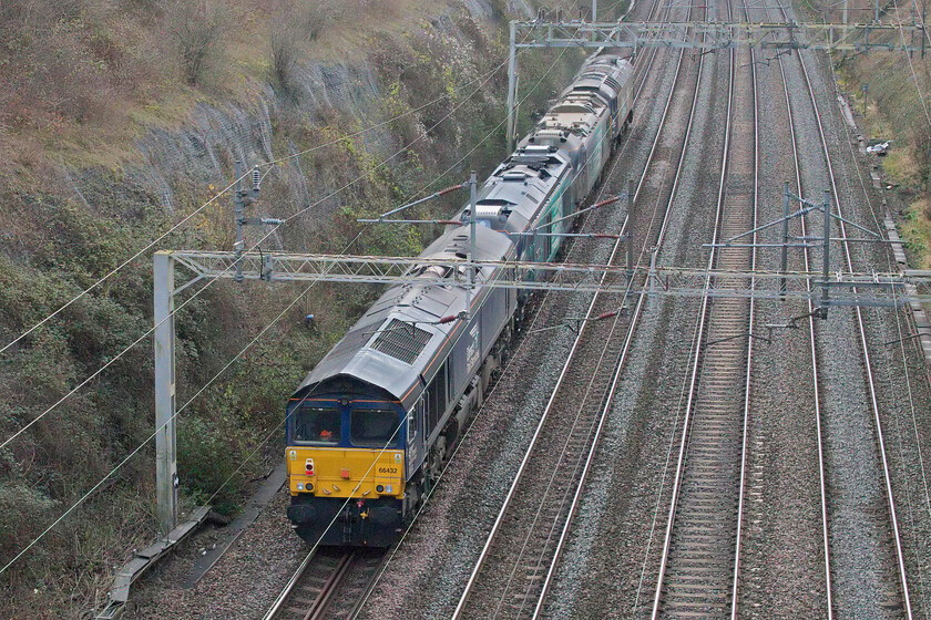 66432, 68001, 88007 & 57306, 06.38 Crewe Gresty Bridge-Wembley Yard (0A68, 9E), Roade cutting 
 The 0A68 06.38 Crewe Gresty Bridge to Wembley Yard Saturday morning light engine move passes through Roade cutting. Rather than the more usual single locomotive (usually a Class 68) on this Saturday morning, it was an interesting combination of 66432 on the rear with 68001 'Evolution', 88007 and 57306 'Her Majestys Railway Inspectorate 175' leading. 
 Keywords: 66432 68001 88007 57306 06.38 Crewe Gresty Bridge-Wembley Yard 0A68 Roade cutting Her Majestys Railway Inspectorate 175 Evolution