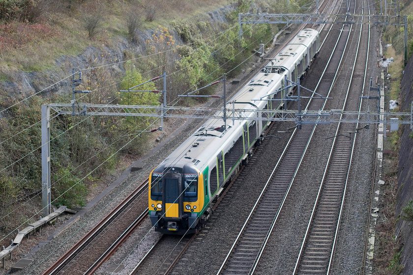 350257, LM 10.54 London Euston-Northampton (2N39), Roade cutting 
 350257 forms the 10.54 Euston to Northampton through Roade cutting. These units have become synonymous with this line and the routes through to Birmingham and Liverpool. There is talk of their time now being numbered as new stock is cascaded form elsewhere but we will see? 
 Keywords: 350257 10.54 London Euston-Northampton 2N39 Roade cutting