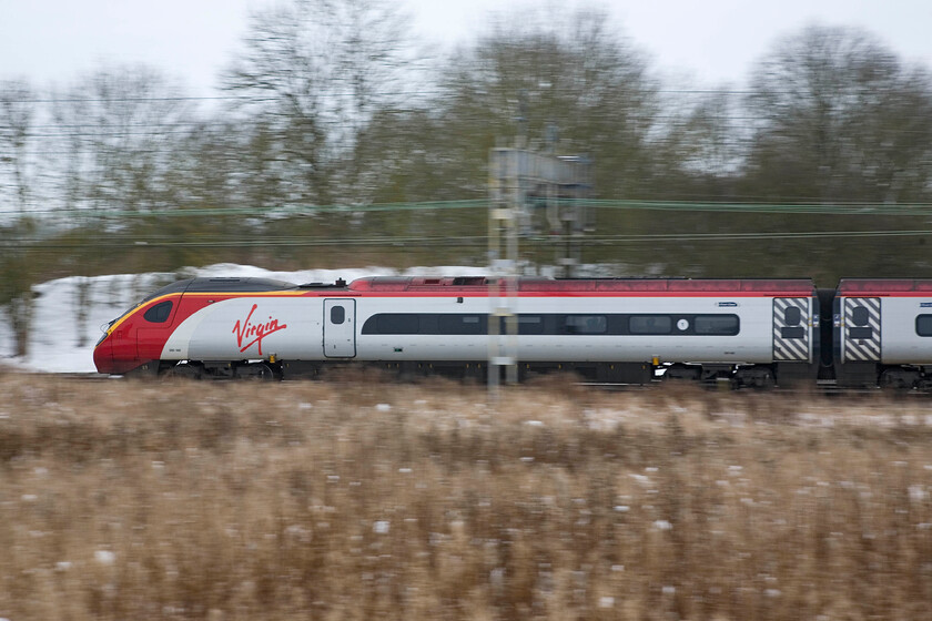 390148, VT 09.15 Manchester Piccadilly-London Euston, Roade 
 Formally named 'Virgin Harrier' (as 390048) until being reformed to become an eleven-car set 390148 passes a snowy Roade with Virgin's 09.15 Manchester Piccadilly to Euston service. 
 Keywords: 390148 09.15 Manchester Piccadilly-London Euston Roade Virgin West Coast Pendolino