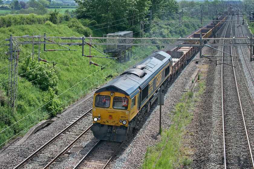 66714, 23.33 North Wembley Junction-Bescot (6G51, 30E), Victoria bridge 
 66714 'Cromer Lifeboat' passes Victoria bridge just south of Roade with the 6G51 23.33 North Wembley Junction to Bescot returning engineering working. Like the previous 6G52 working its starting time was the middle of the night with this one actually being the previous day! However, both trains spent a number of hours in Wembley Yard before then continuing their respective journeys back to Bescot. Out of sight on the rear of the train is 66728 'Institution of Railway Operators'. 
 Keywords: 66714 23.33 North Wembley Junction-Bescot 6G51 Victoria bridge Cromer Lifeboat