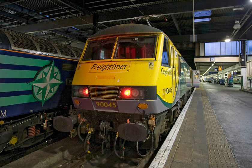 90045, CS 19.34 Wembley InterCity Depot-London Euston sleeper ECS (5S95) & 47712, stabled Thunderbird, London Euston station 
 At the end of platform fifteen of Euston 90043 is pictured having brought the Highland Sleeper empty coaching stock into the station from Wembley. As can be seen, the Class 90 is being hired in from Freightliner to undertake these very short journies. At the adjacent platform DRS' 47712 'Pride of Carlisle' is the acting Thunderbird for the London area of the WCML waiting to assist any miscreant train that disgraces itself! 
 Keywords: 90045 19.34 Wembley InterCity Depot-London Euston sleeper ECS 5S95 47712 stabled Thunderbird London Euston station Caledonian Sleeper Pride of Carlisle