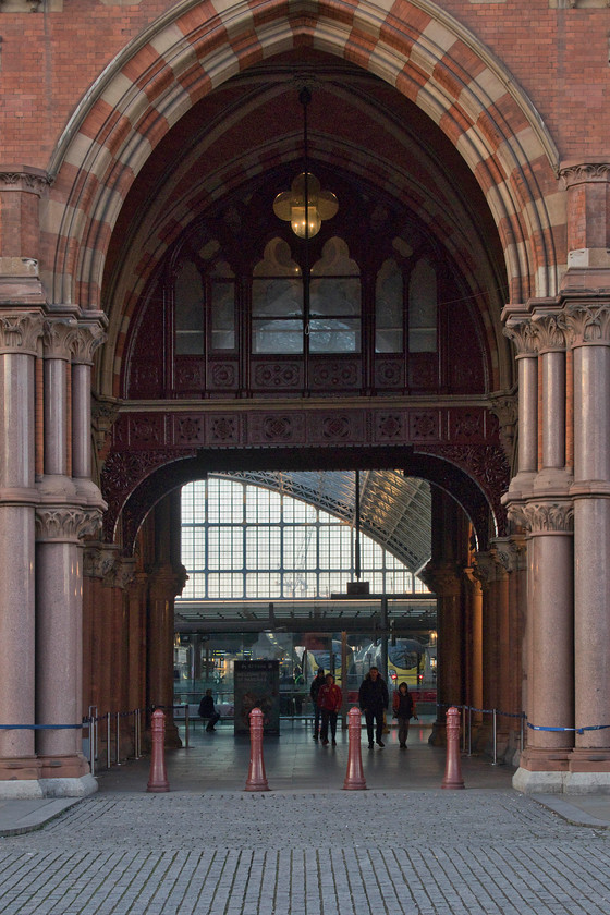 374013, ES 15.31 London St. Pancras-Paris Nord (9036) & 374025, ES 16.01 London St. Pancras-Paris Nord (9038), London St 
 Looking more akin to the entrance to a cathedral than a railway station at St. Pancras! Looking through the huge arch of the Midland Grand hotel into the station trainshed two Eurostar services can be seen. To the left 374013 will soon leave with the 15.31 to Paris Nord whilst to the right 374025 will leave slightly later with the 16.00 service. 
 Keywords: 374013 15.31 London St. Pancras-Paris Nord 9036 374025 16.01 London St. Pancras-Paris Nord 9038 London St. Pancras station Eurostar