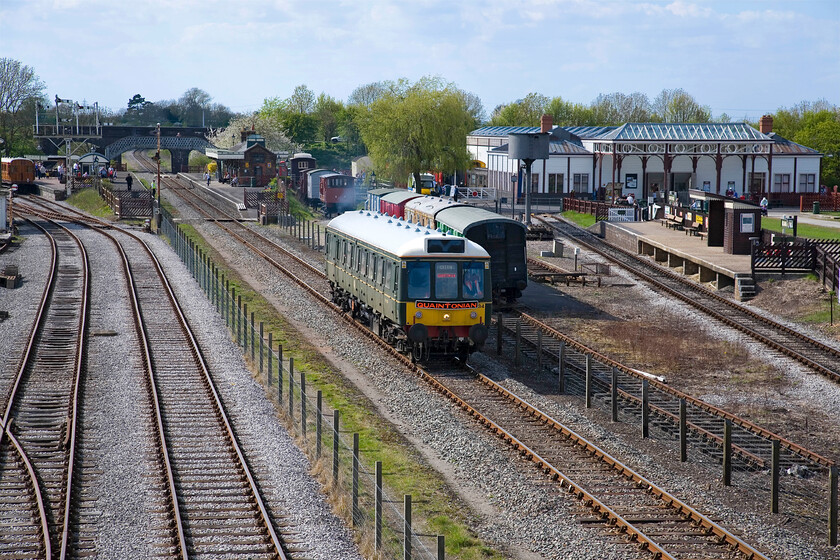 121034, CH 16.05 Quainton Road-Aylesbury (1T91), Quainton Road footbridge 
 Bubble car DMU 121034 leaves The Buckinghamshire Railway Centre's Quainton Road station with the 16.05 shuttle service to Aylesbury with the unusual reporting number (for such a lowly working) of 1T91. The railway centre's Spring Bank Holiday gala was coming to a close with enthusiasts and visitors heading home, with some enjoying a trip on a heritage DMU! 
 Keywords: 121034 16.05 Quainton Road-Aylesbury 1T91 Quainton Road footbridge Chiltern Bubble car