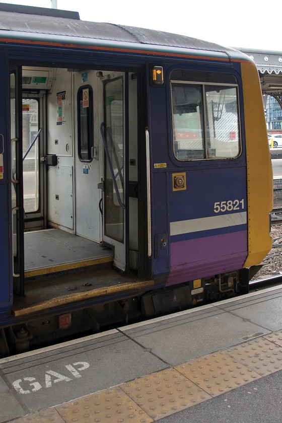 144021 (55821), NT 15.35 Sheffield-Huddersfield (2B60, 2E), Sheffield station 
 The doors are open on 55821 that is one carriage of set 144021. This is a travelling experience that many people in the north will soon be missing as these second generation DMUs are withdrawn from service by the end of this year. The doors shown here contribute to the noisy, draughty and cold travelling experience as the brush seals around the door are so ineffective. Indeed, when I last travelled on a Pacer, I was able to watch the track pass by below the train through the gaps! 
 Keywords: 144021 55821 15.35 Sheffield-Huddersfield 2B60 Sheffield station