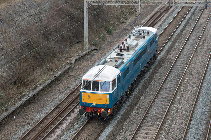 86259, 12.12 London Euston-Rugby Carriage Sidings (0Z68, 39E), Roade cutting 
 Following another successful railtour duty, yesterday hauling the Cumbrian Coast Express, 86259 'Les Ross/Peter Pan' passes back through Roade cutting as the 0Z68 light engine move from Euston to Rugby. This vintage locomotive remains a regular performer on the WCML as it was throughout its working life. I wonder when it first passed through Roade cutting following its introduction to service on 15.01.66? 
 Keywords: 86259 12.12 London Euston-Rugby Carriage Sidings 0Z68 Roade cutting Les Ross Peter Pan AL3 AC electric