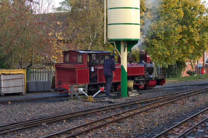 9, taking water, Aylsham station 
 The crew of number 8 'Mark Timothy' replenish its saddle tanks with water after which it will leave the yard area and attach to the front of the 12.40 Aylesham to Wroxham service. Number 8 is named 'Mark Timothy' in memory of the owner's son who sadly passed away at a young age. 
 Keywords: 9 taking water Aylsham station Bure Valley railway Mark Timothy