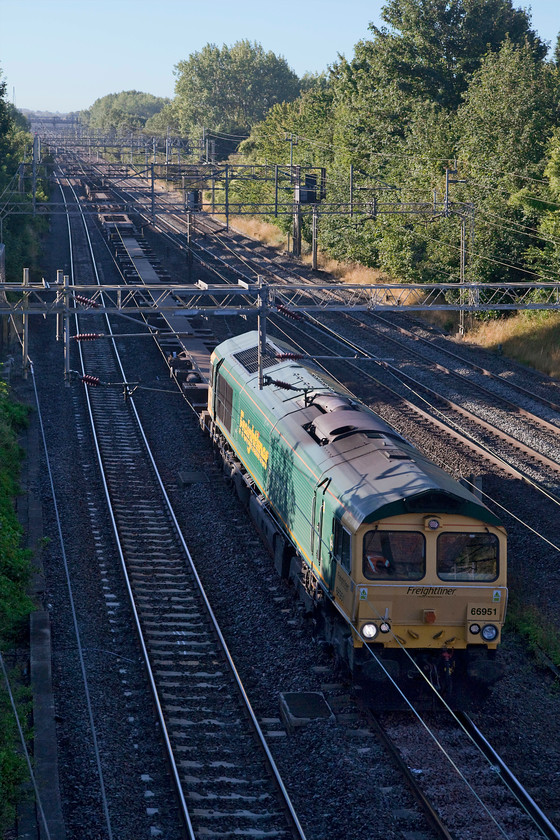 66951, 04.25 Felixstowe North-Lawley Street (4M88), Victoria Bridge 
 66951 leads the completely empty 04.25 Felixstowe to Lawley Street Freightliner working past Victoria Bridge between Northampton and Milton Keynes.. I'm sure that this is a logistical move but towing a load of empty wagons is not exactly the best use of resources? 
 Keywords: 66951 04.25 Felixstowe North-Lawley Street 4M88 Victoria Bridge