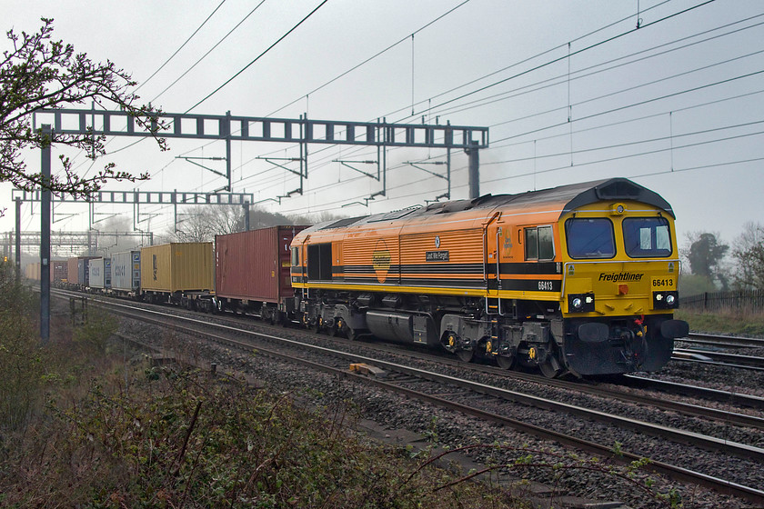 66413, 02.57 Felixstowe North-Garston (4M45), Ashton Road bridge 
 Tis is the first time that I have seen 66413 'Lest we Forget' in this Freightliner Genesee & Wyoming livery applied to only two members of the class. It certainly stands out in the morning gloom as it approaches Roade with the 4M45 02.57 Felixstowe to Garston Freightliner service 
 Keywords: 66413 02.57 Felixstowe North-Garston 4M45 Ashton Road bridge