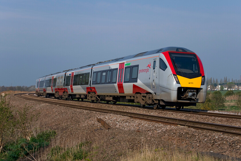 755408, GA 09.50 Peterborough-Ipswich (2L71, 1E), Harts Drove crossing TL273962 
 The new face of Greater Anglia passes across the fens at Whittlesey just to the east of Peterborough. A FLIRT family unit in the form of 755408 works the 2L71 09.50 Peterborough to Ipswich train in glorious lighting with the sun, for once, in the right place! 
 Keywords: 755408 09.50 Peterborough-Ipswich 2L71 Harts Drove crossing TL273962 GA Greater Anglia FLIRT Stadler Rail