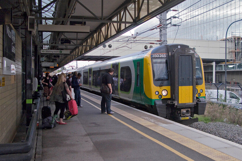 350265, LM 15.33 Birmingham New Street-London Euston (17.06 Milton Keynes Central-London Euston) (1W20), Milton Keynes Central station 
 Our train south from Milton Keynes to London arrives at the station's platform one. We travelled on the very busy 350266 that was, with another unit at the rear, working the 1W20 15.33 Birmingham New Street to Euston service. 
 Keywords: 350265 15.33 Birmingham New Street-London Euston 17.06 Milton Keynes Central-London Euston 1W20 Milton Keynes Central station London Midland Desiro