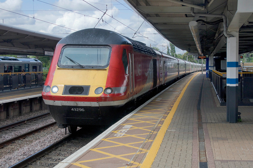 43296, GR 09.00 Edinburgh Waverley-London King`s Cross (1E08, 9L), Potters Bar station 
 Having left Edinburgh at 09.00 43296 is approaching journey's end passing Potters Bar leading the 1E08. From the first of the next month (August), LNER will commence Azuma operations on their Anglo-Scottish workings so their reliance on HST availability will ease allowing them to be taken out of service. This power car has been racing up and down the ECML since its introduction, as part of set 254021, in the autumn of 1978. 
 Keywords: 43296 09.00 Edinburgh Waverley-London King`s Cross 1E08 Potters Bar station