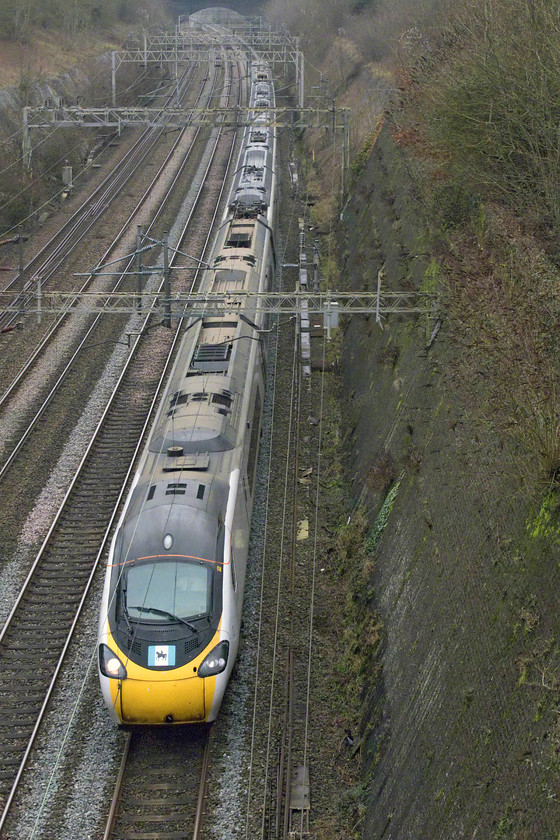 390039, VT 12.30 London Euston-Glasgow Central (1S63, 1E), Roade cutting 
 With its Coventry standard on the front of the cab including an image of Lady Godiva, 390039 'City of Coventry' passes through Roade cutting with the 12.30 Euston to Glasgow Central. This service will get New Year revellers to Scotland in plenty of time to celebrate the start of 2020. 
 Keywords: 390039 12.30 London Euston-Glasgow Central 1S63 Roade cutting Pendolino Avanti West Coast