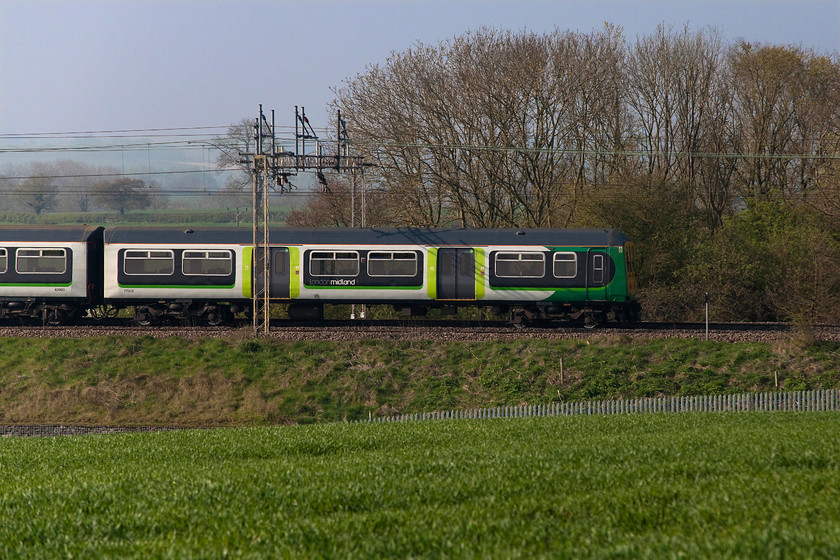 319429, 09.24 Bletchley CS-Northampton ECS (5N19), between Roade & Ashton 
 The regular Saturday morning 09.24 Bletchley Carriage Sidings to Northampton EMUD (Kingsheath) ECS working passes between Roade and Ashton in south Northamptonshire. The ECS working is always a class 319 unit, one a few London Midland keep for bolstering commuter workings, in this particular case, 319429. 
 Keywords: 319429 5N19 between Roade & Ashton