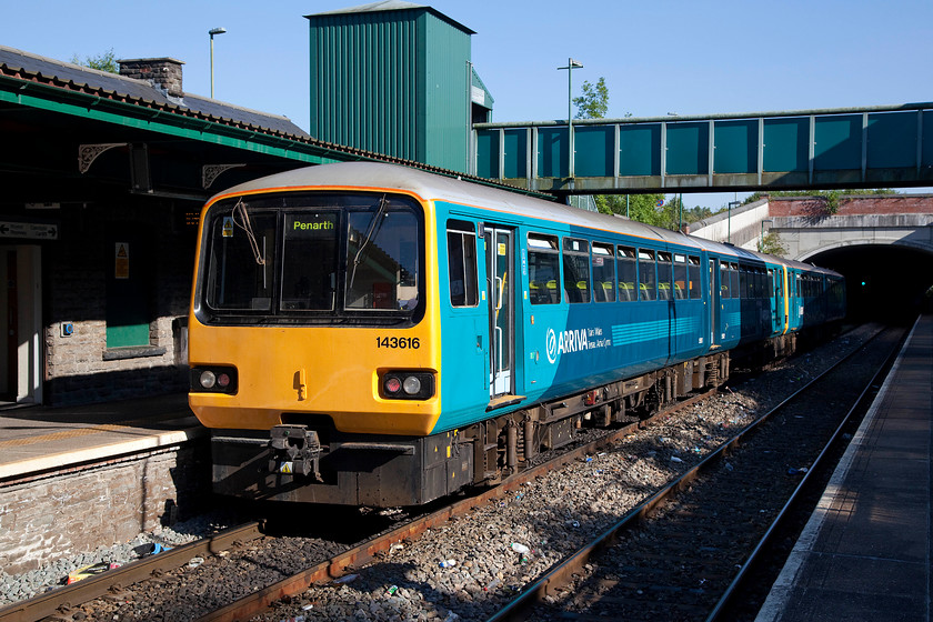 143616 & 143605, AW 17.17 Bargoed-Penarth (2P83), Bargoed station 
 In the glorious late afternoon sunshine, ATW's 143616 and 143605 leave Bargoed station with the 17.17 to Penarth. It is about to enter Bargoed's short tunnel. When I last visited this station in 2008 there was still a signal box at the north end of the station. The 1970 BR structure was decommissioned in August 2013 when the line was resignalled. 
 Keywords: 143616 143605 17.17 Bargoed-Penarth 2P83 Bargoed station