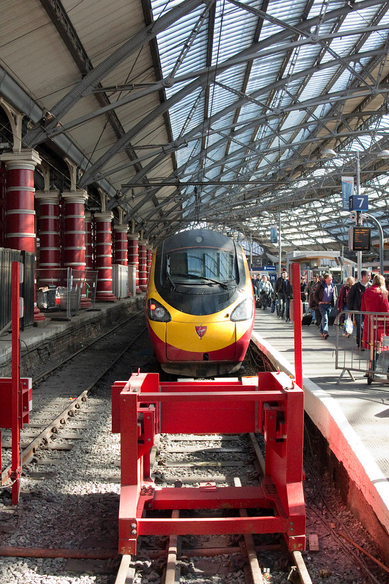 390135, VT 11.07 London Euston-Liverpool Lime Street (1F15), Liverpool Lime Street station 
 390135 'City of Lancaster' stands on the blocks at Liverpool Lime Street's platform seven having arrived with the 1F15 11.07 from Euston. We travelled on this service from Crewe. When the sun shines, the lighting inside Lime Street is superb. At this time, some works were being undertaken to extend and change platform configurations. 
 Keywords: 390135 11.07 London Euston-Liverpool Lime Street 1F15 Liverpool Lime Street station