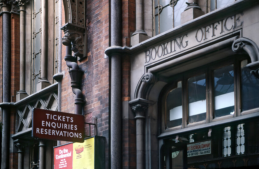 Enamel, London St. Pancras station 
 The entrance to the booking office at St. Pancras is seen complete with a British Railways double flanged enamel. Today this entrance is to the superb Booking Office bar, see..... https://upload.wikimedia.org/wikipedia/commons/2/24/Booking_Office%2C_St_Pancras_International_Station%2C_NW1_%286296266282%29.jpg 
 Keywords: Enamel London St. Pancras station