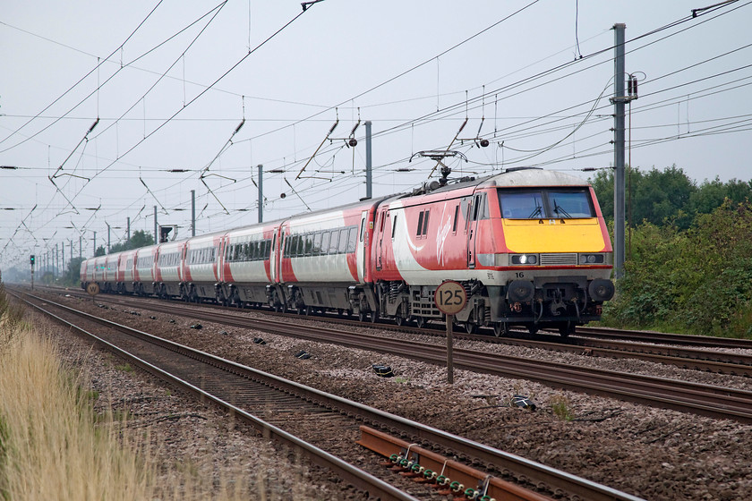 91116, GR 09.00 London Kings Cross-Edinburgh Waverley (1S09, 5L), Biggleswade TL192433 
 The 1S09 09.00 King's Cross to Edinburgh is seen at speed approaching Biggleswade at full line speed. The picture is taken from the safety of a foot crossing that was used by a number of people including dog walkers. This is exactly the type of crossing that Network Rail want to close. 
 Keywords: 91116 1S09 Biggleswade TL192433