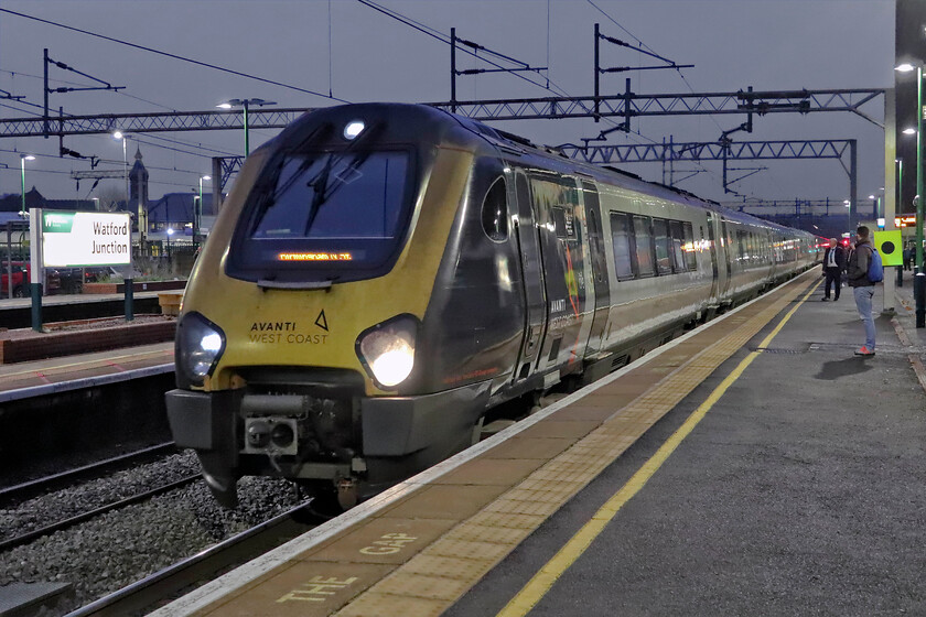 221107 & 221102, VT 16.16 London Euston-Birmingham New Street (9G32, 3L), Watford Junction station 
 In theory, the Class 221 Voyagers have just a month or so left in service with Avanti West Coast; we'll see! In the meantime, I take the opportunity to photograph them whenever the situation arises. 221107 and 221102 pause at Watford Junction working the 16.16 Euston to Birmingham New Street service on a dull and damp November evening. 
 Keywords: 221107 221102 16.16 London Euston-Birmingham New Street 9G32 Watford Junction station