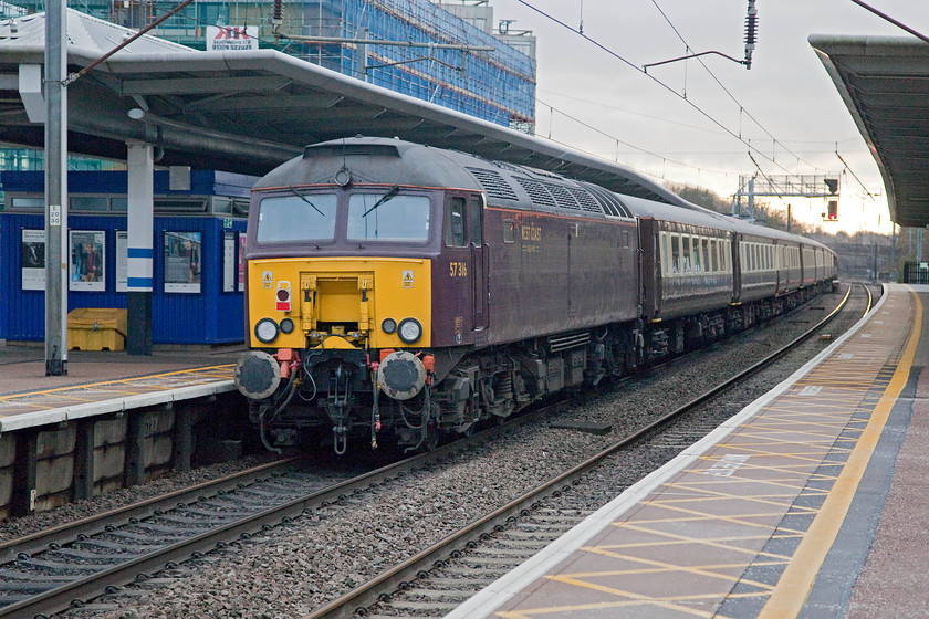 57316, outward leg of The Canterbury Christmas Special, 05.28 Leeds-Canterbury (1Z66), Potters Bar station 
 It is unfortunate that The Canterbury Christmas Special tour from Leeds was powered by a pair of West Coast Railway's class 57s. Their livery is pretty drab at the best of times but in dull December weather such as this at Potters Bar it looks even worse! 57316 is a former Virgin Thunderbird that carried the name ' FAB1'. Then, it wore Virgin's bright red livery and branding, quite a contrast to how it looks now! 
 Keywords: 57316 The Canterbury Christmas Special 05.28 Leeds-Canterbury 1Z66 Potters Bar station