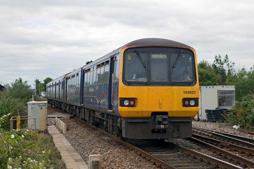 143603, GW 16.12 Paignton-Exmouth (2F45, 1L), Dawlish Warren SX979783 
 I'm sure that the guard has undertaken his revenue protection duties as he's now relaxing in the rear cab of 143603 as it slows for its stop at Dawlish Warren station with the 16.12 Paignton to Exmouth working. This picture is taken from the footbridge that carries thousands of holiday makers from the huge car park down to the beach and attractions that Dawlish Warren has to offer. 
 Keywords: 143603 2F45 Dawlish Warren SX979783