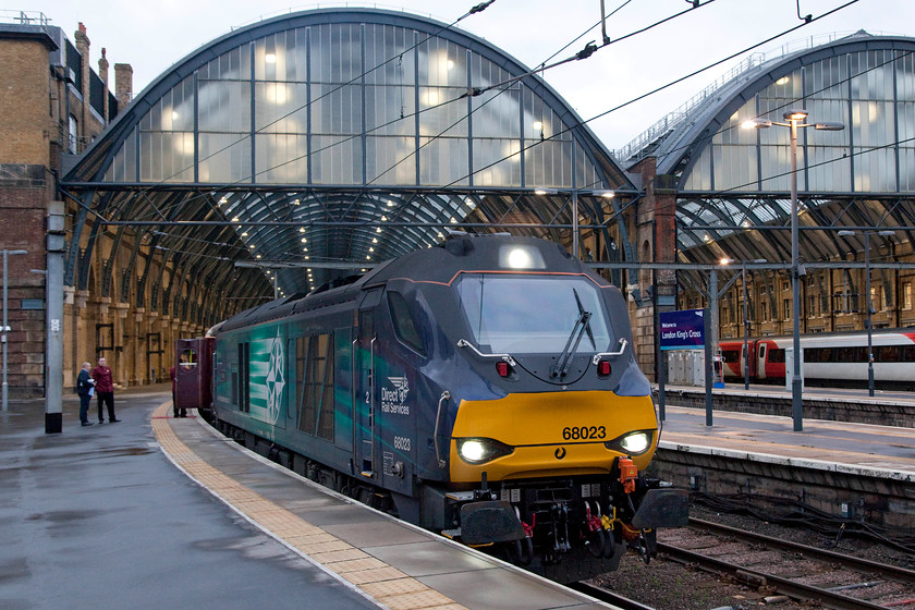 68023, outward leg of The Grassington Dickensian, 08.18 London King`s Cross-Skipton (1Z92), London King`s Cross station 
 It's still half light at London King's Cross with the new lighting inside the station shining brightly. At platform one 68023 'Achilles' waits to leave at the head of The Grassington Dickensian railtour. This is the 1Z92 08.18 to Skipton for the passengers to visit its Christmas market. 
 Keywords: 68023 The Grassington Dickensian 08.18 London King`s Cross-Skipton 1Z92 London King`s Cross station