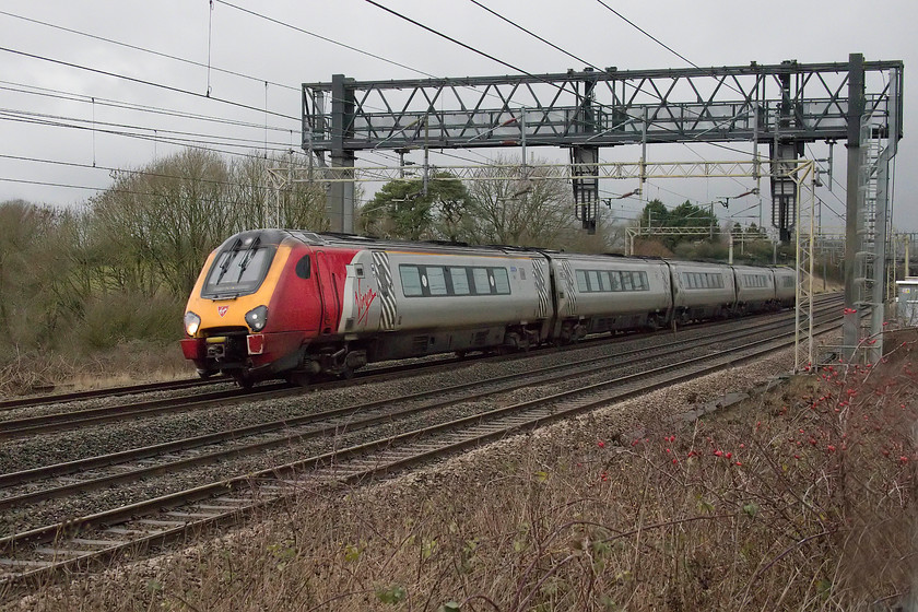 Class 221, VT 10.55 Holyhead-London Euston (1A27, 3E), between Roade & Ashton 
 A class 221 speeds southwards between Roade and Ashton forming the 10.55 Holyhead to London Euston. It had begun to spot with rain, not surprising given the black clouds that were streaming in from the north west! 
 Keywords: Class 221 10.55 Holyhead-London Euston 1A27 between Roade & Ashton