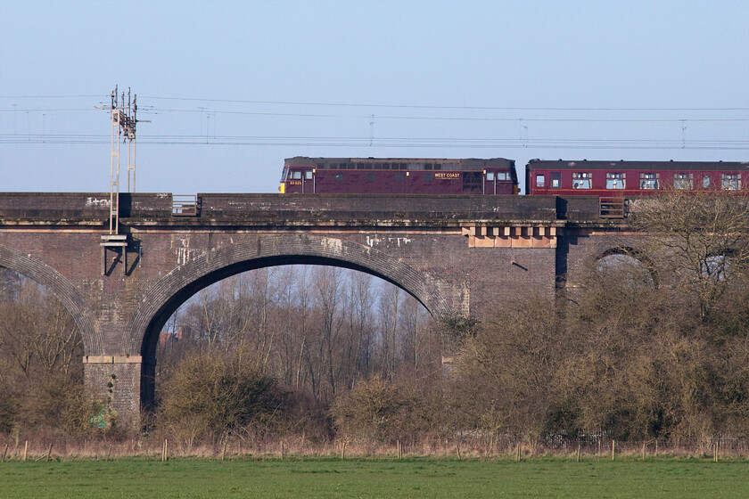 33025, outward leg of The Cheshireman, 06.39 London Euston-Chester (1Z69, 6E), Haversham SP818425 
 33025 brings up the rear of The Cheshireman charter running as the 1Z69 06.39 Euston to Chester. The train is crossing Wolverton (or Haversham depending on your particular bent) viaduct just to the north of Milton Keynes. At this point, the charter was running some thirty-five minutes late having left London forty-five adrift. It made up the lost time arriving at its destination slightly early! This particular Class 33 was a regular performer on the Cardiff to Portsmouth services back in the 1980s for example........ https://www.ontheupfast.com/p/21936chg/29805504204/x33025-bristol-temple-meads-cardiff 
 Keywords: 33025 The Cheshireman 06.39 London Euston-Chester 1Z69 Haversham SP818425 Sulzer rat