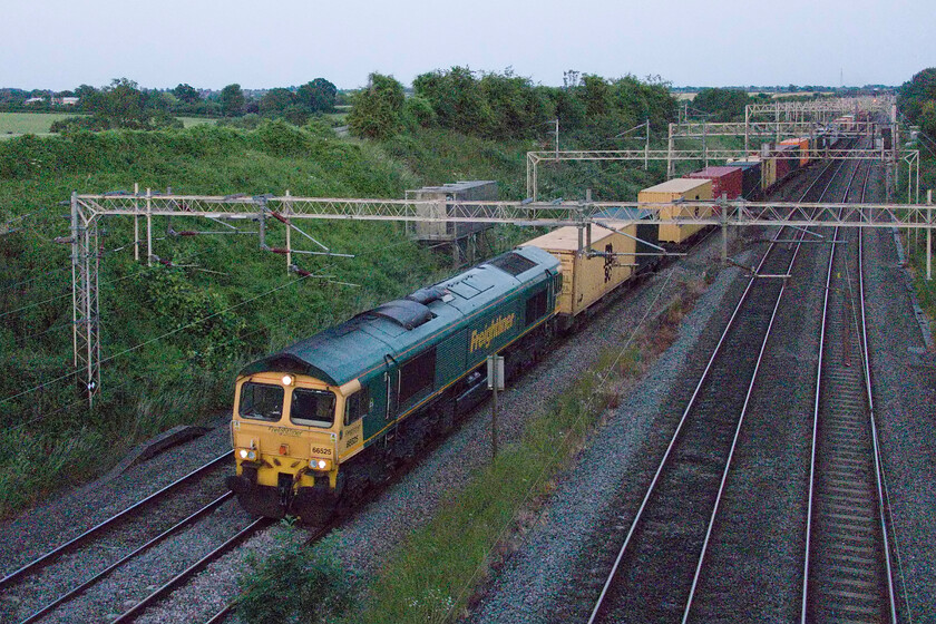 66525, 14.33 Felixstowe North-Coatbridge (4S88, 20E), Victoria bridge 
 This is what I had been wanting to photograph and at 21.29 I managed it all be it in really low light conditions! I have heard the 4S88 14.33 Felixstowe to Coatbridge pass from my house near here many times but have never photographed it due to its timing. Usually, it is rostered for electric haulage but as with all Freightliner services, they will attach what is available at any time and as such, 66525 is seen in charge. It is a shame that it was running about twenty down as those valuable minutes would have made a massive difference to the lighting! 
 Keywords: 66525 14.33 Felixstowe North-Coatbridge 4S88 Victoria bridge Freightliner