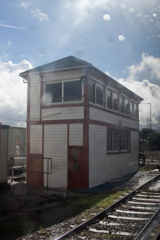 St. Andrew`s Junction signal box (GW, 1910) 
 After the rain came the sun! A terrible picture of St. Andrew's Junction signal box. It is a GWR Type 27C box dating from 1910. It contained a 53 lever frame but now only has a mini-panel controlling the Severn Beach line and access to the Bristol Bulk Handling Terminal. It also controls the level crossing just seen behind it. It's good to see that it has been in receipt of some recent attention and that it has been painted in the correct heritage colours and retains a GWR style nameplate on the front. 
 Keywords: St. Andrew`s Junction signal box