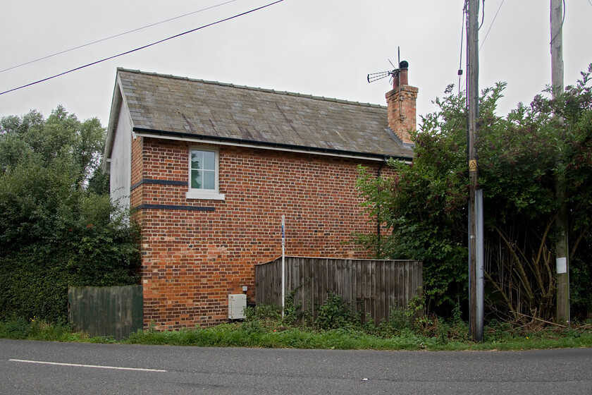 Former French Drove signal box (GN, 1882) 
 When I last visited this spot over forty years previously French Drove signal box was in an open and exposed position on the Fens now it is surrounded on all sides by trees but mercifully it still stands and is in use as a private residence. The 1882 Great Northern box controlled the level crossing as well as being a block post between Murrow West and Postland. It also controlled and up and down loop to the north of the crossing. I am not sure why the loops were installed on the former GN & GE Joint line in this remote area but perhaps they were installed during the war years when traffic increased dramatically in this area, advice anybody? 
 Keywords: Former French Drove signal box Great Northern