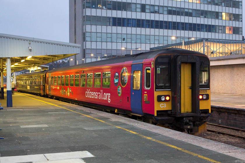 153325 & 153361, stabled, Plymouth station 
 With the 1960s brutalist Intercity House dominating the scene, 150325 and 150361 sit in one of Plymouth's bay platforms awaiting their first service next morning. 
 Keywords: 153325 15336 Plymouth station