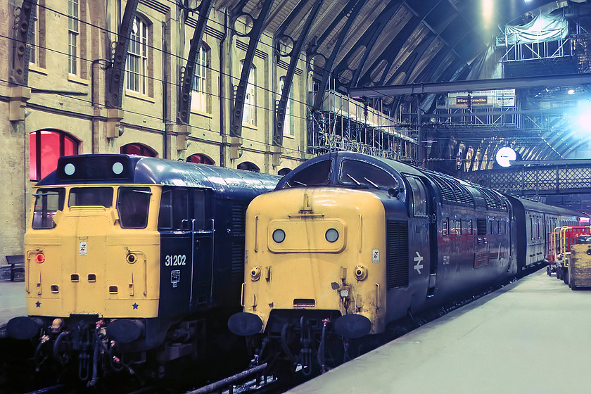 31202, station pilot & 55021, 18.14 York-London King`s Cross (1A31), London King`s Cross station 
 The clock above the platform reads 20.46 at King's Cross. To the left is 31202 acting as one of the station pilots. To the right, 550021 'Argyll and Sutherland Highlander' arrived earlier at the head of the 1A31 18.14 from York. Notice the work going on at King's Cross that included some restoration of the superb roof. 
 Keywords: 31202 55021 18.14 York-London King`s Cross 1A31 London King`s Cross station