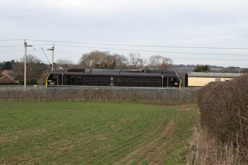 67005, outward leg of 'The Powerful Pennine Panorama', 07.00 London Euston-Leeds (1Z79, 2E), Milton Malsor SP741557 
 A lightly panned shot of 67005 'Queen's Messenger' at the rear of the outward 'Powerful Pennine Panorama' charter as it passes Milton Malsor due south of Northampton. Running as 1Z79 the charter left Euston at 07.00 arriving bang on time at Leeds having taken a circuitous route via the Trent Valley, Manchester Piccadilly, Manchester Victoria and then the Calder Valley arriving at its destination from the west. 
 Keywords: 67005 'The Powerful Pennine Panorama' 07.00 London Euston-Leeds 1Z79 Milton Malsor SP741557 Queen's Messenger