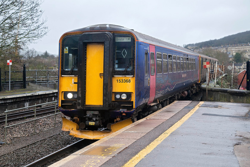 153368 & 150248, GW 08.53 Weymouth-Bristol Temple Meads (2V88, 2E), Bath Spa station 
 153368 and 150248 are corridor non-connected units seen here entering Bath Spa in the pouring rain working the 08.53 Weymouth to Bristol Temple Meads. The scene here has changed very little over the years apart from the removal of the middle tracks. For quite sometime I thought that it was to change quite significantly with the installation of the electrification paraphernalia. However, the government's decision to end the wires at Thingley Junction has put paid to Bath being 'under the wires'; for the moment at least! 
 Keywords: 153368 150248 2V88 Bath Spa station