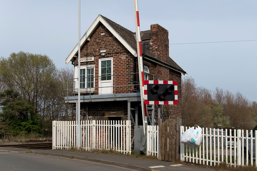 Whitehouse signal box (NE, e.1874) 
 The rear of Whitehouse signal box just to the east of Middlesborough. Whilst it retains its North Eastern characteristics and features it has been somewhat disfigured by the steel steps and balcony at this end. 
 Keywords: Whitehouse signal box