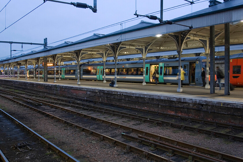 170206, LE 16.38 Norwich-Cambridge, Norwich station 
 Caused by the use of a slow shutter speed, motion-blurred passengers board the 16.38 train to Cambridge at Norwich station. Greater Anglia's 170206 will work the train via Ely. 
 Keywords: 170206 16.38 Norwich-Cambridge Norwich station