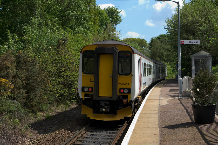 156407, LE 11.44 Sheringham-Norwich (2S13, 1L), Roughton Road station 
 Great Anglia's 156407 leaves Roughton Road station working the 11.44 Sheringham to Norwich. This unit is one of the nine that GA operates. The remaining 105 units are found from Scotland, down to the East Midlands such is their successful design. 
 Keywords: 156407 2S13 Roughton Road station