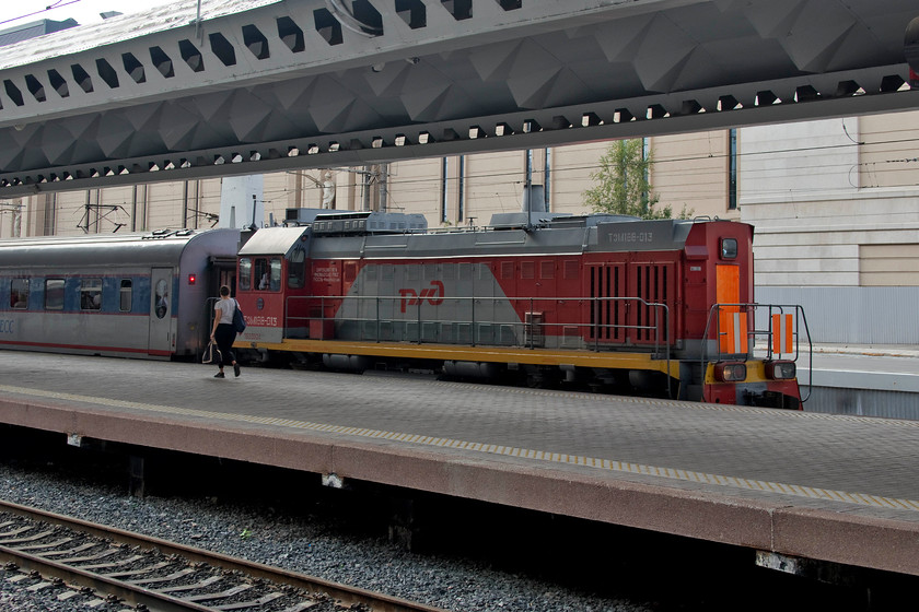 TZM18V-013, station pilot, St. Petersburg Moskovski station 
 Station pilot TZM18V-013 has brought empty stock in for a service that will leave St. Petersburg Moskovski station. There are thousands of these shunters on the RZD network that undertake a wide verity of duties from tasks such as this through to freight workings. 
 Keywords: TZM18V-013 St. Petersburg Moskovski station