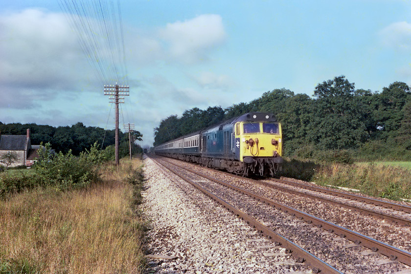 50047, 06.00 Plymouth-London Paddington (1A86), Rudge ST835509 
 50047 Swiftsure passes Fairwood Farm near the village of Rudge between Westbury and Frome with the 1A86 06.00 Plymouth to Paddington. Notice the driver and secondman in the cab no doubt checking me out as a potential hazard but I am on a farm occupation crossing but, looking at my position, I am the 'wrong' side of the gate. 
 Keywords: 50047 06.00 Plymouth-London Paddington 1A86 Rudge ST835509