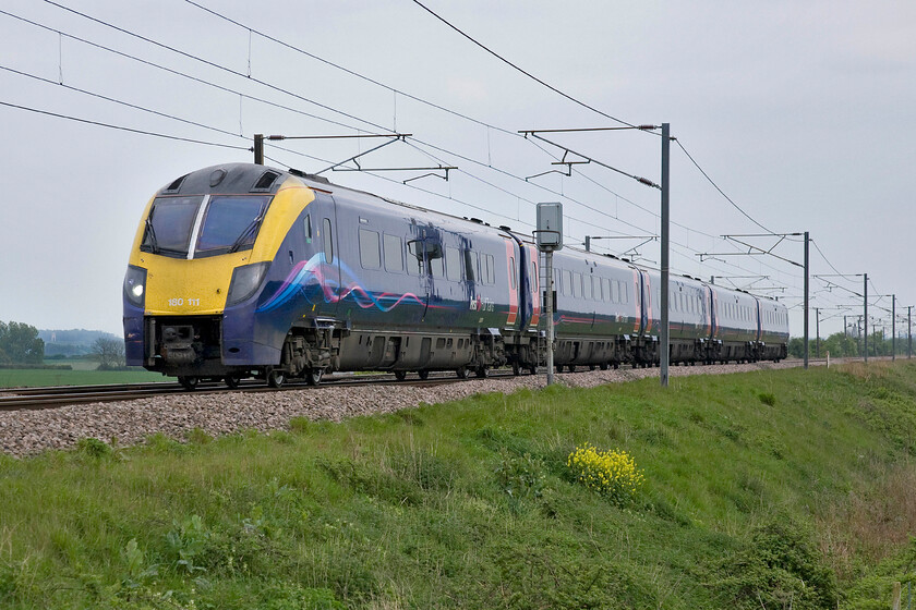 180111, HT 14.48 London King's Cross-Hull (1H05), Frinkley Lane crossing SK906436 
 Former First Great Western Adelante 180111 races north past Frinkley Lane crossing in Lincolnshire forming Hull Trains' 14.48 King's Cross to Hull service. When this unit transferred to its new operator all that was needed, as part of the much-needed re-fit, to be undertaken to the exterior was the replacement of the FGW logo with Hull Trains as both TOCs are part of the First Group. 
 Keywords: 180111 14.48 London King's Cross-Hull 1H05 Frinkley Lane crossing SK906436 Hull Trains Alston Adelante