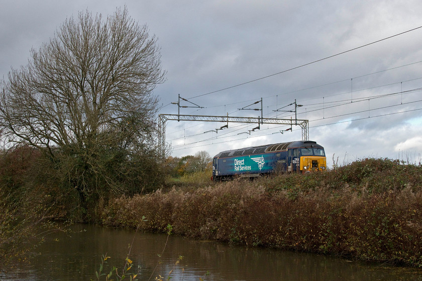 57009, 09.45 Wolverton Centre Sidings-Rugby (5Q27, 31L), Stretton Wharf SP432810 
 57009 'Pride of Crewe' runs light engine by the side of the Oxford Canal at Stretton Wharf. It is running as the 5Q27 09.45 Crewe to Rugby with the former Virgin Thunderbird taking up residence at Rugby to act as a rescue locomotive. All the locomotives stabled the length of the WCML at strategic locations are moved regularly with them returning to DRS's Gresty Bridge and Kingmoor depots for exams and servicing. 
 Keywords: 57009 09.45 Wolverton Centre Sidings-Rugby 5Q27 Stretton Wharf SP432810 Pride of Crewe