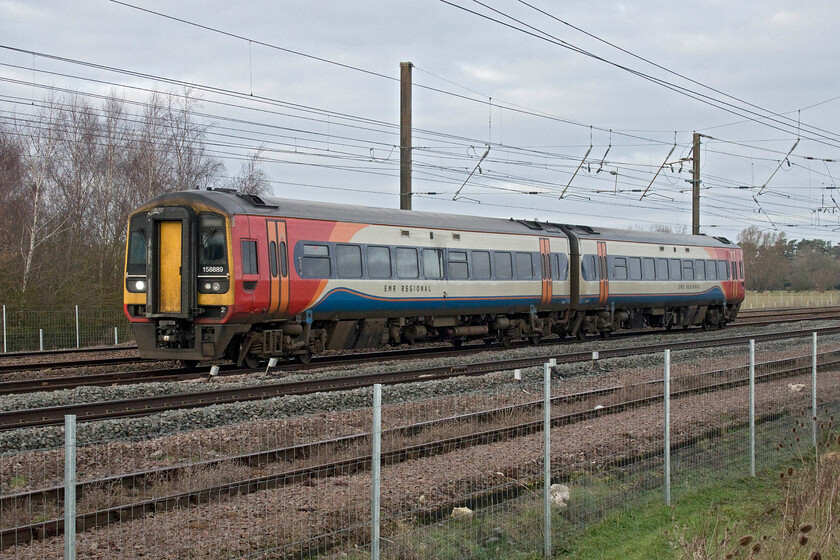 158889, EM 07.40 Sheffield-Norwich (1L05, 3L), Tallington Dowmac 
 EMR's 158889 passing Tallington on the up-fast line working the 1L05 07.40 Sheffield to Norwich service. The Express Sprinters are now approaching twenty-five years of age and have proved themselves to be an enduring design in that time. However, EMR has disposed of a number of them in the last two years replacing them with cascaded Class 170s. With their fleet of Class 222 Meridans becoming surplus soon I just wonder if these may be seen on the ECML route operating these EMR Regional services. 
 Keywords: 158889 07.40 Sheffield-Norwich 1L05 Tallington Dowmac EMR Express Sprinter