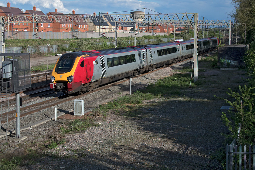 221103, VT 17.10 London Euston-Holyhead (1D91, 2E), site of Roade station 
 As my readers will know, I am not a fan of the Voyager family of trains be they operated by CrossCountry or Avanti West Coast as seen here. However, in the case of these former Virgin liveried Class 221s, their time is now limited with new bi-mode units having been ordered to replace them. So I make a point of photographing them when I am out as here at the site of Roade station. In superb evening light with a dramatic sky 221103 'Christopher Columbus' works the 1D91 17.10 London Euston to Holyhead service. 
 Keywords: 221103 VT 17.10 London Euston-Holyhead 1D91 site of Roade station Voyager Christopher Columbus