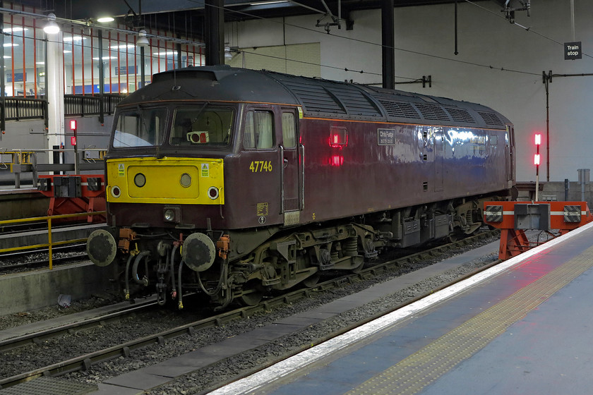 47746, stabled for ECS from The Winter Cumbrian Mountain Express), London Euston station 
 47746 'Chris Fudge 29.7.70 - 22.6.10' sits on the blocks at London Euston. Earlier that morning it brought the ECS for the 'The Winter Cumbrian Mountain Express' in from Acton via the North London Line. It sat at Euston all day to be re-attached when the railtour arrived back later that evening. 86259 'Les Ross/Peter Pan' then towed the stock and 47 ensemble back to Acton. 
 Keywords: 47746 London Euston station