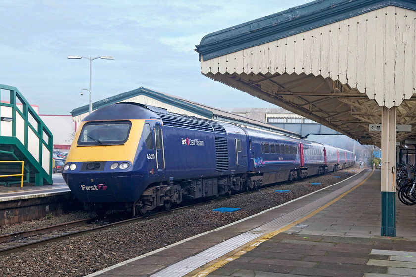 43010, GW 10.30 London Paddington-Bristol Temple Meads (1C10, 4E), Chippenham station 
 With the weak winter light beginning to burn through the veil of high cloud 43010 brings the 10.30 London Paddington to Bristol Temple Meads to halt at Chippenham station. 43010 is an early power car being built in 1975/6 and introduced as part of frontline Western Region set 253005. Unfortunately, this set's other power car, 43011, is no more as it was destroyed in the Ladbroke Road crash in October 1999. 
 Keywords: 43010 1C10 Chippenham station