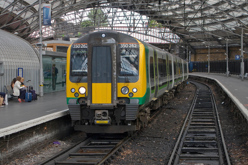 350262, LM 14.31 Walsall-Liverpool Lime Street (1F48), Liverpool Lime Street station 
 350262 comes to a halt at Liverpool Lime Street with the 14.31 from Walsall. As a resident of Walsall, it is interesting to think that you could get a train directly to Liverpool. Notice the Virgin first class lounge to the far left of the image cunningly disguised as a mini aircraft hanger! 
 Keywords: 350262 14.31 Walsall-Liverpool Lime Street 1F48 Liverpool Lime Street station London MIdland Desiro