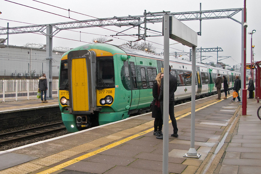 377708, SN 13.22 Watford Junction-Clapham Junction, Harrow & Wealdstone station 
 A Southern Electrostar arrives at Harrow and Wealdstone station woking the 13.22 Milton Keynes to Clapham Junction service. My wife and I had changed trains here in order to reach our destination, Kensington Olympia. 
 Keywords: 377708 13.22 Watford Junction-Clapham Junction Harrow & Wealdstone station Sothern Electrostar