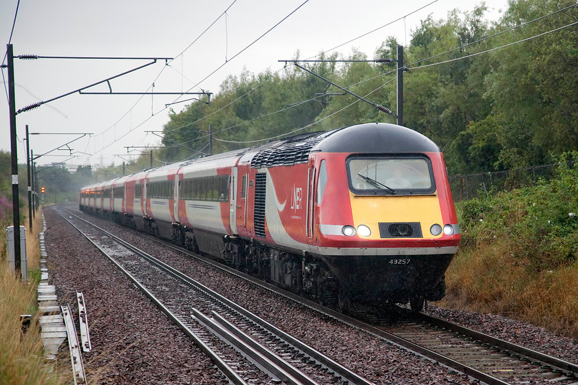 43257, GR 07.52 Aberdeen-London King`s Cross (1E11, 5L), Musselburgh station 
 Taking photographs of fast trains in the pouring rain presents its own problems. In the bad old days of using Kodachrome 64 taking a picture of an HST moving at speed would have been asking just too much. However, in the modern digital world, cranking the ISO up to 3200 allows a 1/1600 sec. shutter speed to be used and a presentable image to be produced. However, there is some inevitable digital 'noise' produced but by careful post image editing, this can largely be eradicated. 43257 'Bounds Green' leads the 07.53 Aberdeen to King's Cross through Musselburgh station. 
 Keywords: 43257 07.52 Aberdeen-London King`s Cross 1E11 Musselburgh station